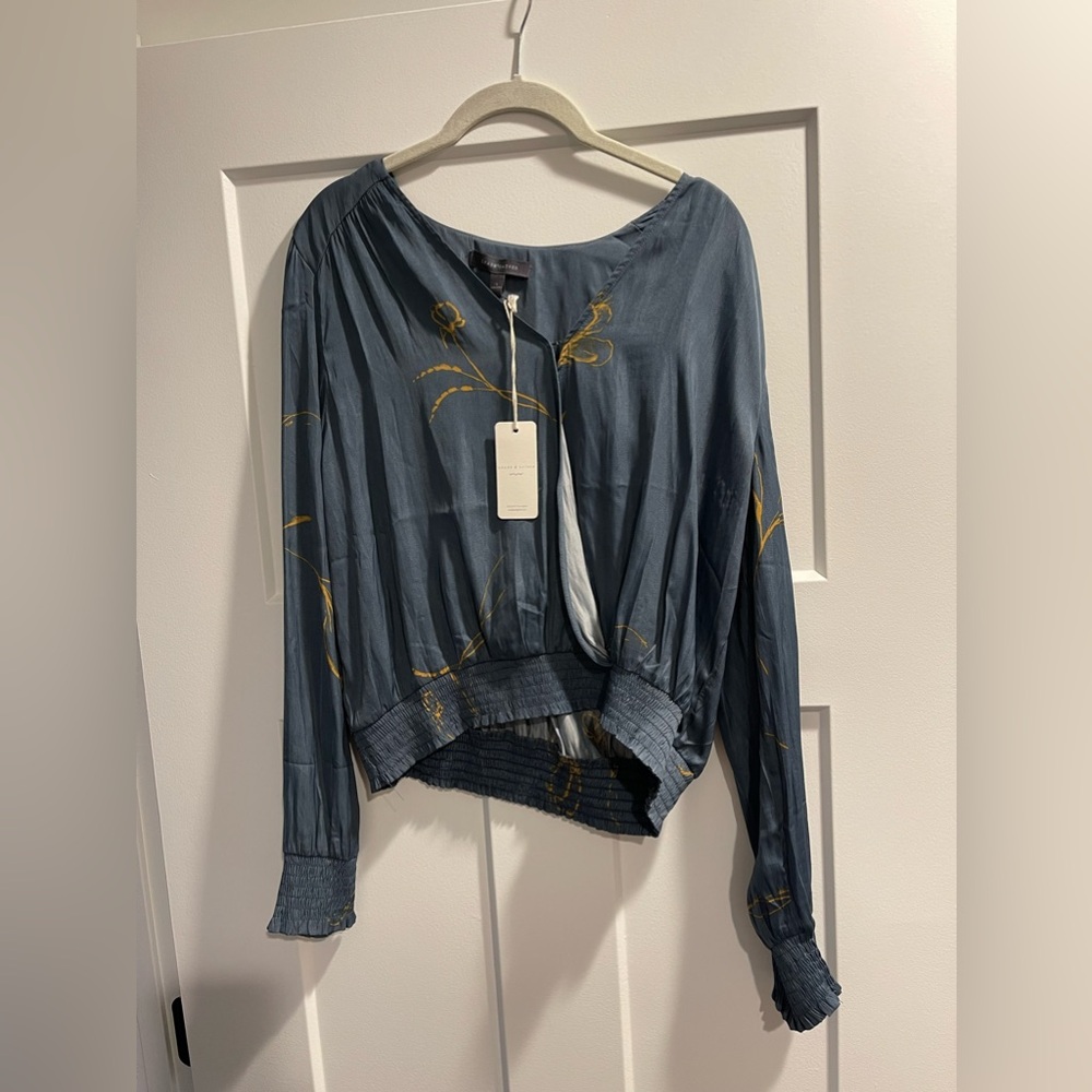 Blue blouse with mustard color flower detail